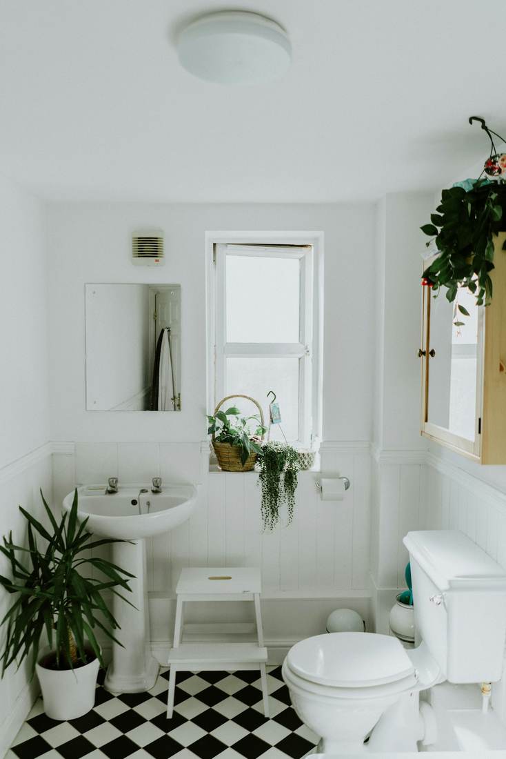 A bright bathroom with a freestanding tub