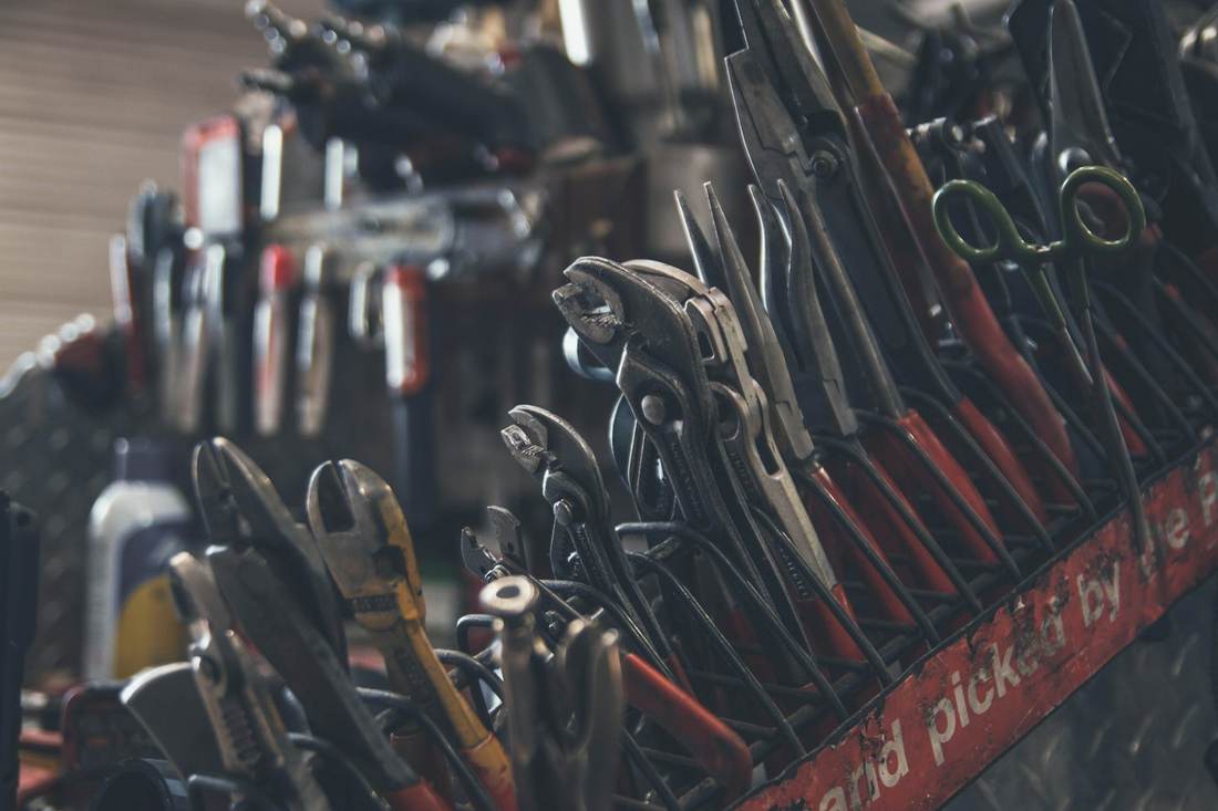 Hand tools laid out on a workbench